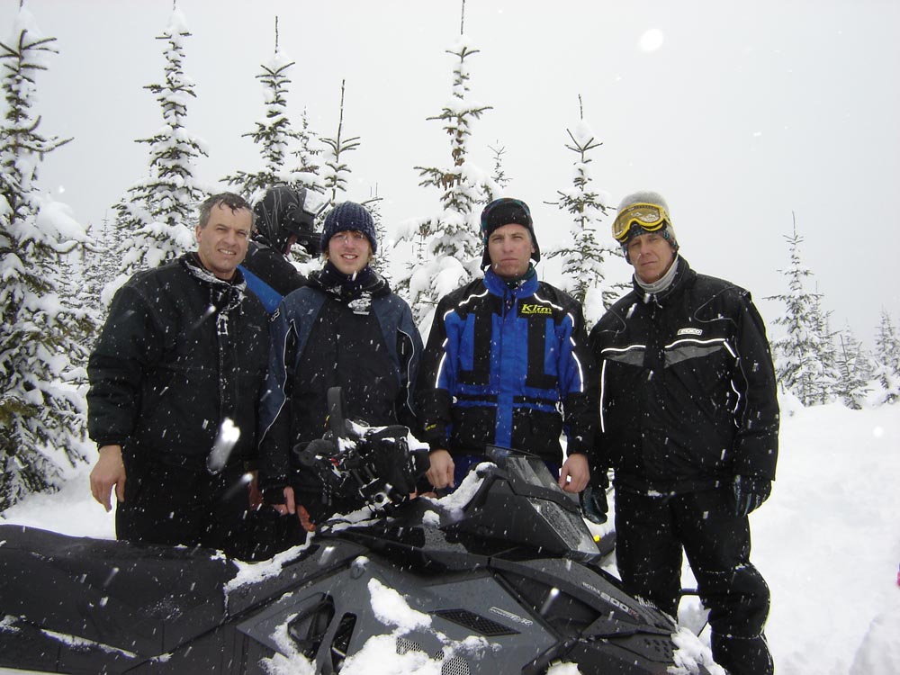 Calvin, Josh, Clayton, and Dan - A group photo capturing the 3 generation team at Hi-Torque Rollers snowmobiling in the BC mountains in March 2008.